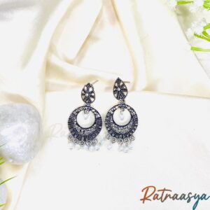 Boho oxidized silver hoop earrings with intricate design and pearl drops on white background