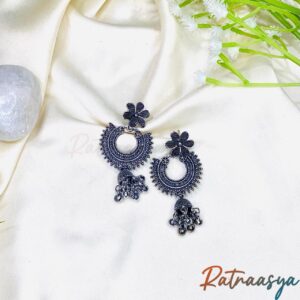 Bloom motif oxidized silver jhumka earrings with floral tops and crescent design on white background