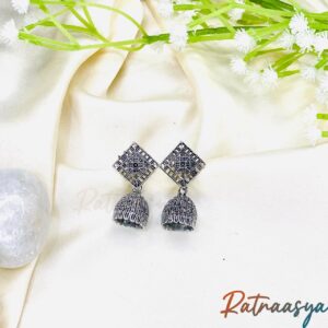 Geometric stud oxidized silver jhumka earrings with square motifs and hanging jhumka bells on white background