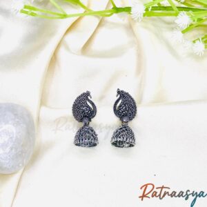 Paisley oxidized silver peacock jhumka earrings with detailed patterns on white background