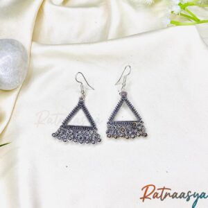 Tribal triangle oxidized silver dangler earrings with intricate detailing and dangling beads on white background