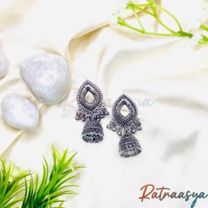 Classic oxidized silver drop jhumka earrings with teardrop design on white background