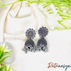 Floral stud oxidized silver jhumka earrings with detailed floral top and hanging jhumka bells on white background