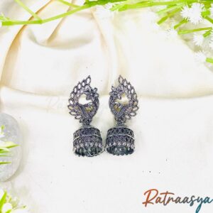 Floral peacock oxidized jhumki earrings by Ratnaasya with intricate detailing and anti-tarnish finish displayed on cream background